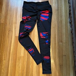 Team Tights black with red and royal blue “rips” never worn Size Small